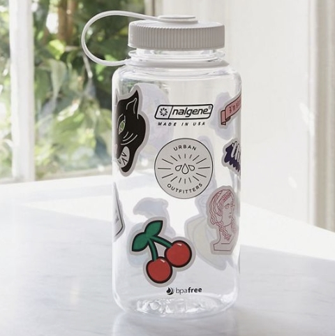 A bottle covered with stickers